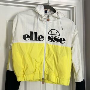 Ellesse crop windbreaker. Never worn. Size M  White/Yellow/Black logo